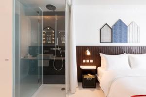 Voodi või voodid majutusasutuse Ruby Zoe Hotel London toas