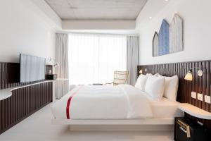 Voodi või voodid majutusasutuse Ruby Zoe Hotel London toas