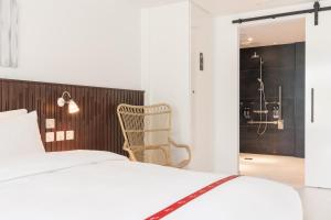 Voodi või voodid majutusasutuse Ruby Zoe Hotel London toas