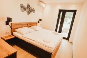 Postel nebo postele na pokoji v ubytování Hotel U Racka