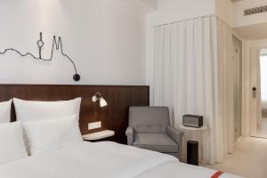 Letto o letti in una camera di Ruby Ella Hotel Cologne