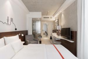 Letto o letti in una camera di Ruby Ella Hotel Cologne
