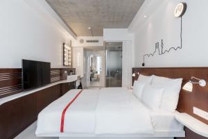 Letto o letti in una camera di Ruby Ella Hotel Cologne