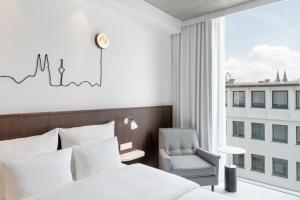 Letto o letti in una camera di Ruby Ella Hotel Cologne