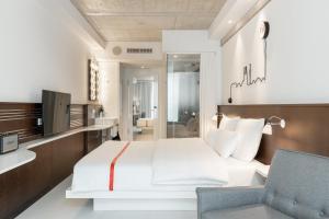 Letto o letti in una camera di Ruby Ella Hotel Cologne