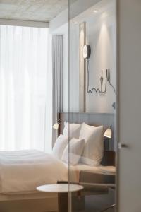 Letto o letti in una camera di Ruby Ella Hotel Cologne