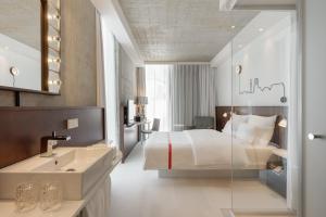 Letto o letti in una camera di Ruby Ella Hotel Cologne