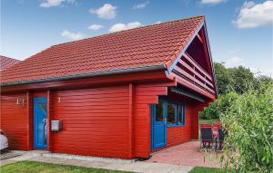 a red house with a red roof at 2 Bedroom Awesome Home In Boiensdorf in Boiensdorf