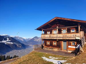 a wooden house on top of a mountain at Zillertaler Sennhuette in Hart im Zillertal
