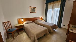 Postel nebo postele na pokoji v ubytování GH Hotel