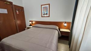 Postel nebo postele na pokoji v ubytování GH Hotel
