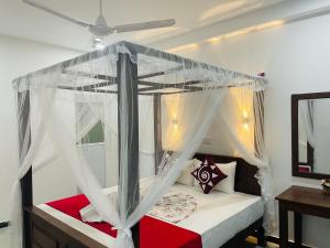 A bed or beds in a room at Cinnamon City