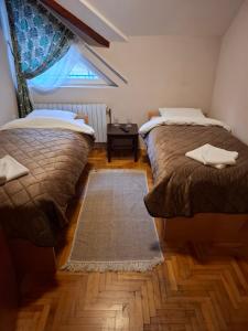 Postel nebo postele na pokoji v ubytování Hotel Koliba na Grza