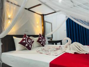 A bed or beds in a room at Cinnamon City