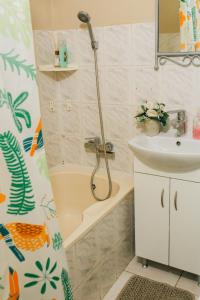 a bathroom with a shower and a sink at Спокойная квартира недалеко от термального басейна in Berehove