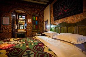 Postel nebo postele na pokoji v ubytování Shaxi absolute art absolute B & B