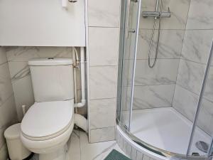 a bathroom with a toilet and a shower at Charme apt a Paris ideal for 3p in Paris +17 photos