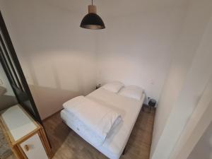 Ένα ή περισσότερα κρεβάτια σε δωμάτιο στο Superbe appartement