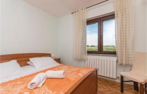 Postel nebo postele na pokoji v ubytování Holiday Home Privlaka 03