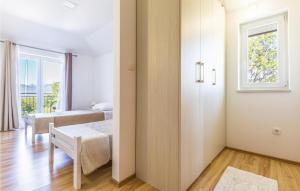 Postel nebo postele na pokoji v ubytování Four-Bedroom Holiday Home In Blato Na Cetini