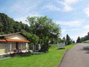 a house on the side of a road with a sign at Kantinho da Serra in Nova Petrópolis +16 photos