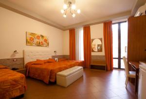 Postel nebo postele na pokoji v ubytování Hotel Ester