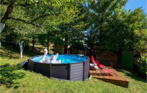 a swimming pool with swans in a yard at Awesome Home In Lic With Wifi in Lič +26 photos