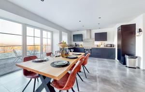 a kitchen and dining room with a table and chairs at 3 Bedroom Beautiful Home In Charnois in Charnois