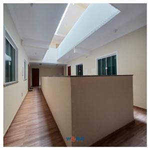 an empty room with a long hallway with a ceiling at Pousada Estrela Mares 307 in Cabo Frio