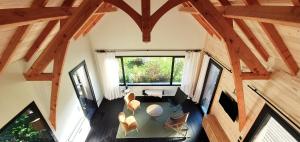 an overhead view of a living room with wooden beams at Le séchoir de Valadon in Aillas
