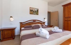 Posteľ alebo postele v izbe v ubytovaní Two-Bedroom Holiday Home In Ploce