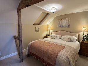 Voodi või voodid majutusasutuse Gooseyard at Middle Farm and Cottages toas