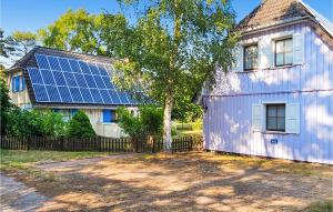 a house with solar panels on the side of it at Amazing Home In Prerow With Wifi in Prerow