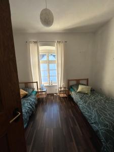 Postel nebo postele na pokoji v ubytování Altstadtwohnung Balve