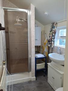 a bathroom with a shower and a sink at Cottage in Wells in Wells