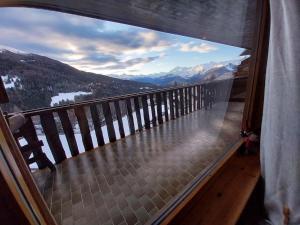 a balcony with a view of a mountain at Casa Cornella cir226 in Pila
