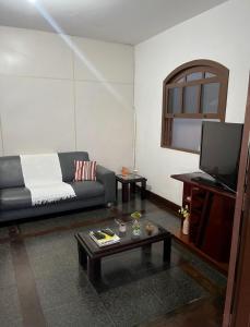 Χώρος καθιστικού στο Casa pé na areia com vista deslumbrante