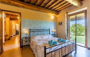 a bedroom with a bed and a large window at Awesome Home In Volterra in Montaperti