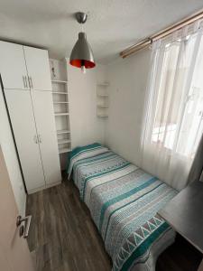 En eller flere senge i et værelse på Arriendo hermoso departamento la serena + 10 billeder