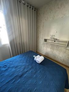 Ένα ή περισσότερα κρεβάτια σε δωμάτιο στο Apartamento terreo super confortavel