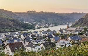 a view of a town with a river and houses at Lovely Apartment In Burgen With Wifi in Burgen