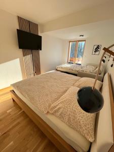 Postel nebo postele na pokoji v ubytování Slunečný apartmán
