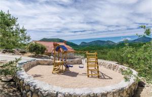 a playground in the middle of a rock wall at Gorgeous Home In Zaton Veliki in Zaton