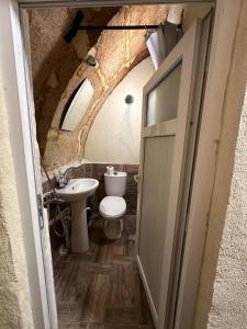 a bathroom with a toilet and a sink at KING SOLOMON PALACE in Avanos