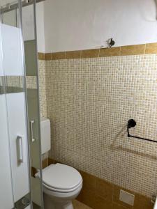 a bathroom with a toilet and a shower at Casa Vacanze Central Cincotta in Lipari +27 photos
