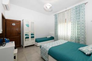 Posteľ alebo postele v izbe v ubytovaní B&B Marina House Porto Ercole