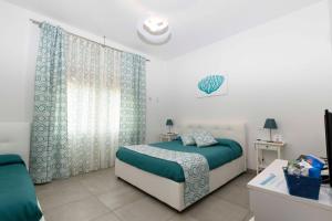 Posteľ alebo postele v izbe v ubytovaní B&B Marina House Porto Ercole