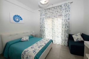 Posteľ alebo postele v izbe v ubytovaní B&B Marina House Porto Ercole