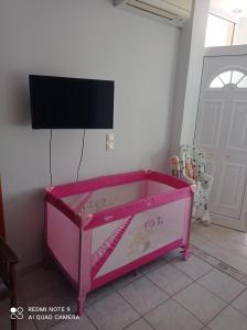 A television and/or entertainment centre at "By The Sea" Family apartments