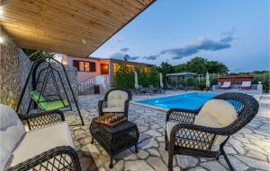 a patio with two chairs and a swimming pool at Cozy Home In Slivnica in Slivnica +27 photos